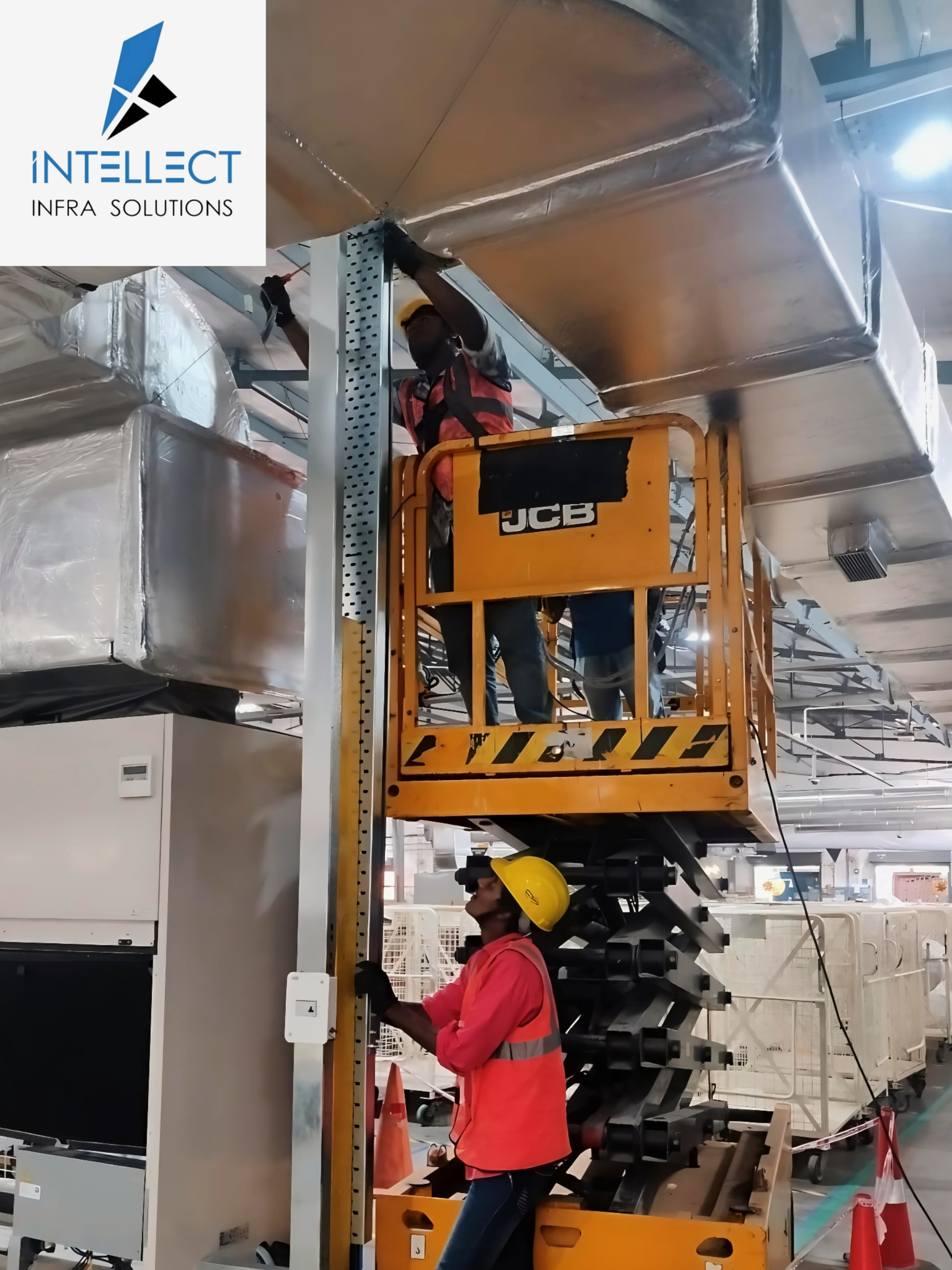 HVAC technicians working on AC unit installation